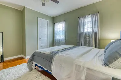 a bedroom with a bed and a window at Humble home with free breakfast offered if requested! in Chicopee