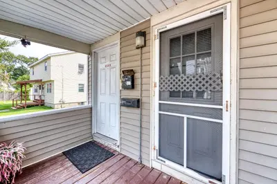 a front door of a house with a window at Humble home with free breakfast offered if requested! in Chicopee
