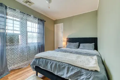a bedroom with a large bed and a window at Humble home with free breakfast offered if requested! in Chicopee
