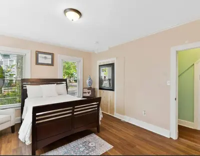 a bedroom with a bed and a window at Beautiful Studio Apartment in Historic House in New Haven