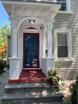 a front door of a house with a red door at Beautiful Studio Apartment in Historic House in New Haven