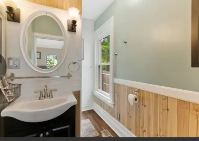 a bathroom with a sink and a mirror at Beautiful Studio Apartment in Historic House in New Haven