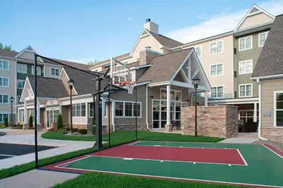a basketball court in front of a building at Residence Inn by Marriott Albany Clifton Park in Clifton Park