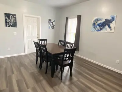 a dining room with a table and chairs at 3rd Base Apt 1 All Star Baseball Rentals in Oneonta
