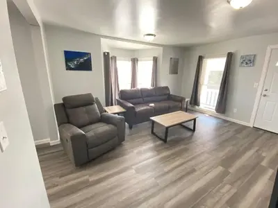 a living room with two couches and a coffee table at 3rd Base Apt 2 All Star Baseball Rentals in Oneonta