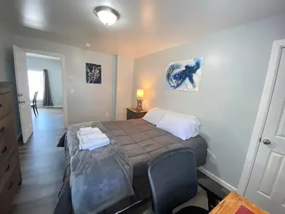 a bedroom with a bed with two towels on it at 3rd Base Apt 2 All Star Baseball Rentals in Oneonta