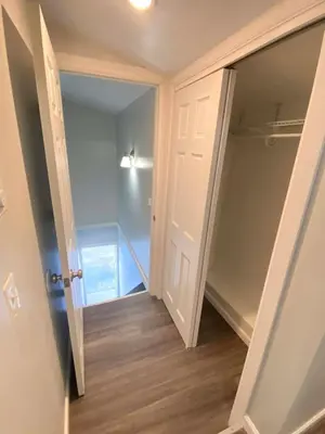 an empty walk in closet with a glass door at 3rd Base Apt 2 All Star Baseball Rentals in Oneonta