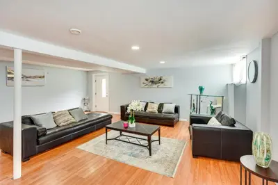 a living room with two couches and a table at Cozy Albany Vacation Rental about 5 Mi to Downtown! in Albany