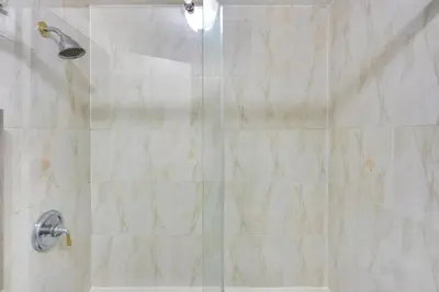 a bathroom with a shower with a glass door at Cozy Albany Vacation Rental about 5 Mi to Downtown! in Albany