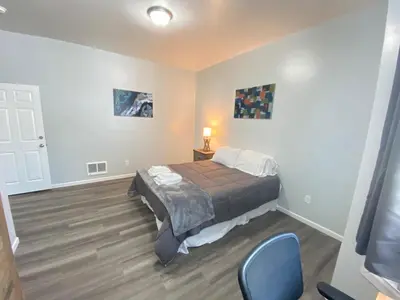 a bedroom with a bed and a table and chairs at Double Play Apt 1 All Star Baseball Rentals in Oneonta