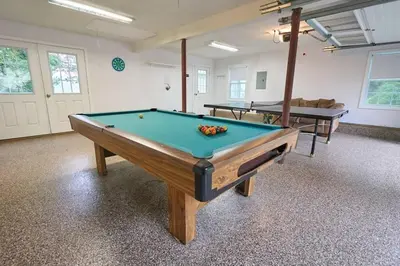 a billiard room with a pool table in it at Fun on the Lake in East Hampton