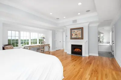 a bedroom with a bed and a fireplace at Lakeview Expanse in Bethlehem
