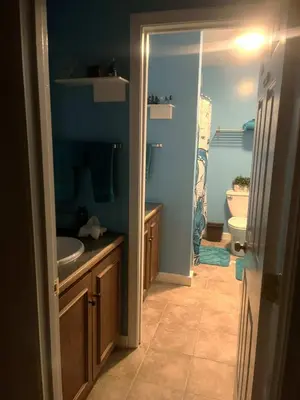 a blue bathroom with a sink and a toilet at Must See Pirate Suite Ski On Off Jiminy - Mtn View Fully Redone Decor in Hancock