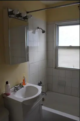 a bathroom with a sink and a shower and a tub at West End Haven in Hartford