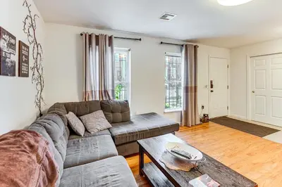 a living room with a couch and a table at 3br private Apartment in Jersey City