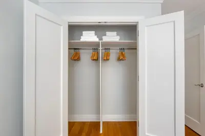 a closet with white walls and an open door at Kips Bay 1br w gym nr empire state building NYC-1214 in New York