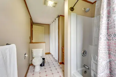 a bathroom with a toilet and a shower at Buskirk Vacation Rental with Deck and Putting Green! in Buskirk