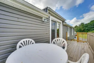 a white table and chairs on a wooden deck at Buskirk Vacation Rental with Deck and Putting Green! in Buskirk