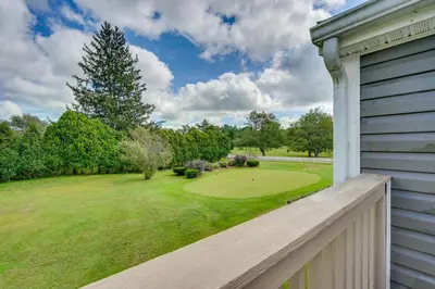 a view of a golf course from the porch of a house at Buskirk Vacation Rental with Deck and Putting Green! in Buskirk