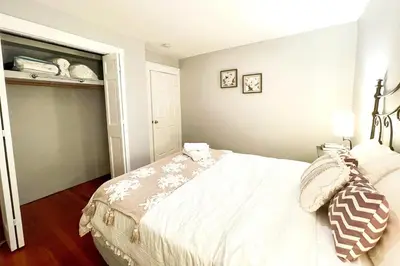 a bedroom with a large bed in a room at Modern Home off I-95 Perfect for Families & Business Stay with Ample Parking in Stamford