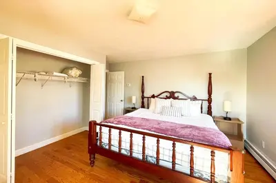 a bedroom with a large bed in a room at Modern Home off I-95 Perfect for Families & Business Stay with Ample Parking in Stamford