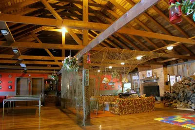 a large room with a wooden ceiling with wooden floors at Cabin A-frame - Beautiful Cabin in Laurel Island in East Hampton