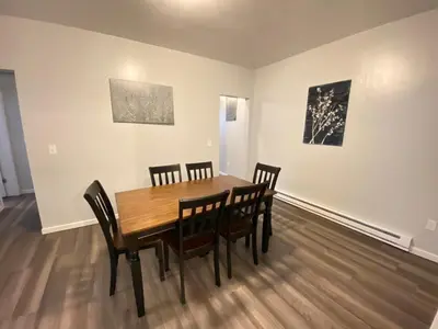 a dining room with a wooden table and chairs at Double Play Apt 2 All Star Baseball Rentals in Oneonta