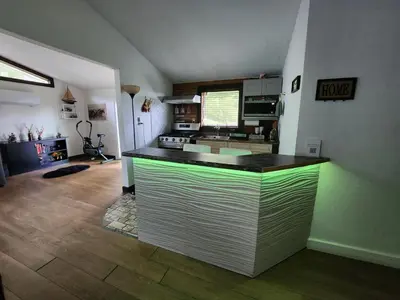 a kitchen with a counter top in a room at little cozy house in a village in Mountain Dale