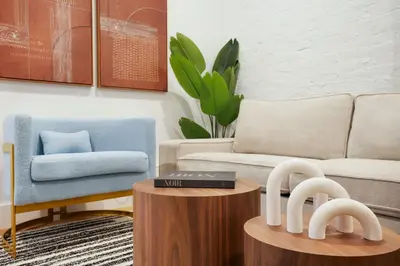 a living room with a couch and a table at 1290-7 New Renovated 2 Bedrooms in UES in New York