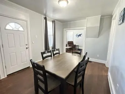 a dining room with a wooden table and chairs at Home Plate Apt 1 All Star Baseball Rentals in Oneonta