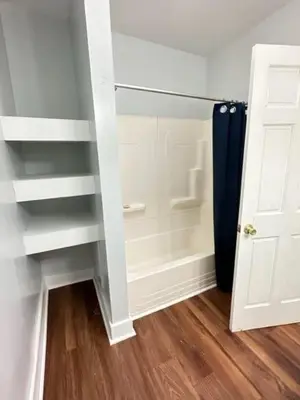 a closet with a glass door and a stair case at Home Plate Apt 1 All Star Baseball Rentals in Oneonta