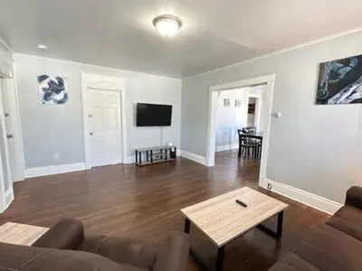 a living room with a couch and a table at Home Plate Apt 1 All Star Baseball Rentals in Oneonta
