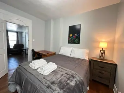 a bedroom with a bed with two towels on it at Home Plate Apt 1 All Star Baseball Rentals in Oneonta