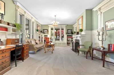 a living room filled with furniture and a fireplace at DeBary Inn in Summit