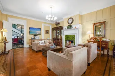 a living room with two couches and a fireplace at DeBary Inn in Summit