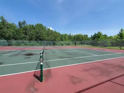 a tennis racket on a tennis court at Mt Snow Condo with Pool Mountain Views Half Mile to Mtn in Dover