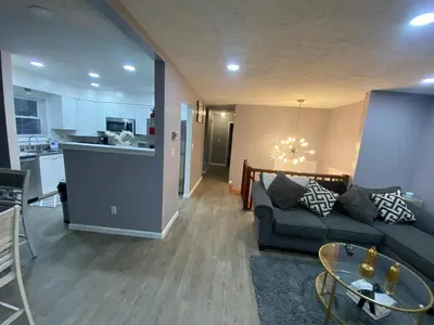 a living room with a couch and a kitchen at Home in Tobyhanna, Poconos Mountain, Pennsylvania in Tobyhanna