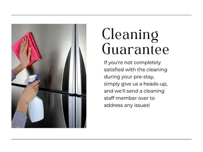 a picture of a woman cleaning a refrigerator at XL Center 1-BR Condo DWNTN Hartford Easy Parking in Hartford