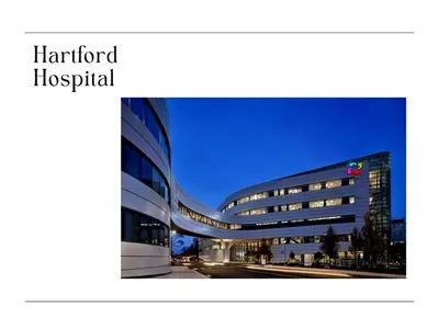 a large hospital building at night with the lights on at XL Center 1-BR Condo DWNTN Hartford Easy Parking in Hartford