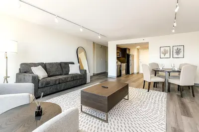 a living room with a couch and a table at XL Center 1-BR Condo DWNTN Hartford Easy Parking in Hartford