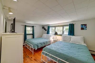 a bedroom with two beds and a television in it at Rustic Bainbridge Retreat with Spacious Yard! in Bainbridge