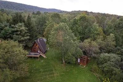 an overhead view of a cabin in a forest at Sunday Hollow in Margaretville