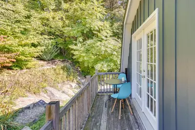a patio with a table and chairs on a deck at Charming Claverack Retreat with Serene Deck! in Claverack