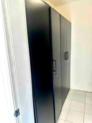 a glass elevator in a room with a wall at 5-A Diamond in Yonkers in Yonkers