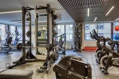 a gym with treadmills and tread machines at UWS 2BR w Elevator Gym DM Playroom Rooftop NYC-868 in New York
