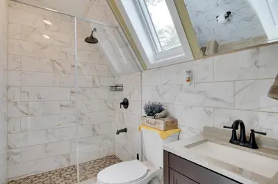 a bathroom with a toilet and a sink at Fire Pit and On-Site Pond Hudson Valley Home! in Wappingers Falls