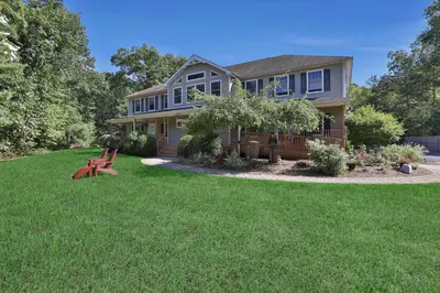 a house with a bench in the yard at Moondance Ridge Suites in New Paltz