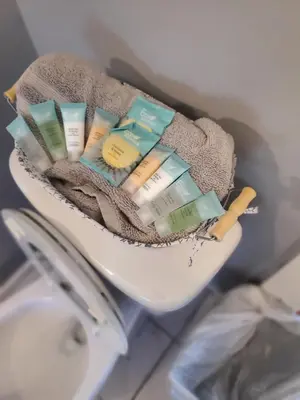 a pile of toothbrushes and toothpaste in a toilet at downtown and secluded in Manchester
