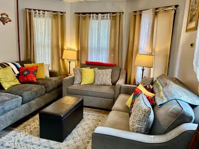 a living room with two couches and a couch at Cozy First Floor Apartment in Chicopee