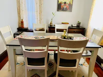a dining room table with two chairs and a table and a table and chairsktop at Cozy First Floor Apartment in Chicopee